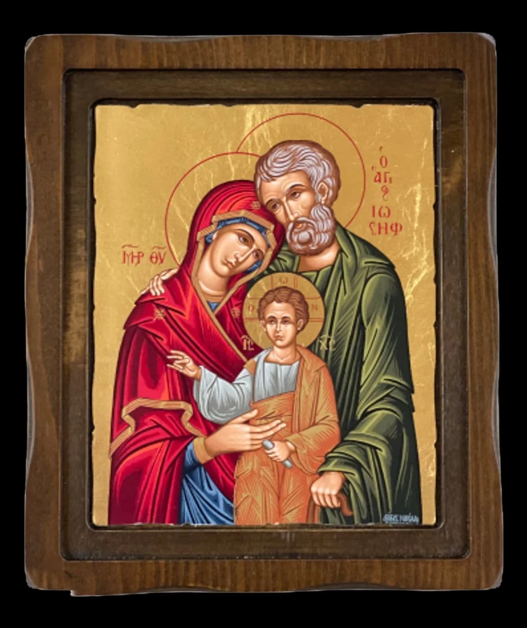Icon of the Holy Family on a gold ground set in a dark wooden frame