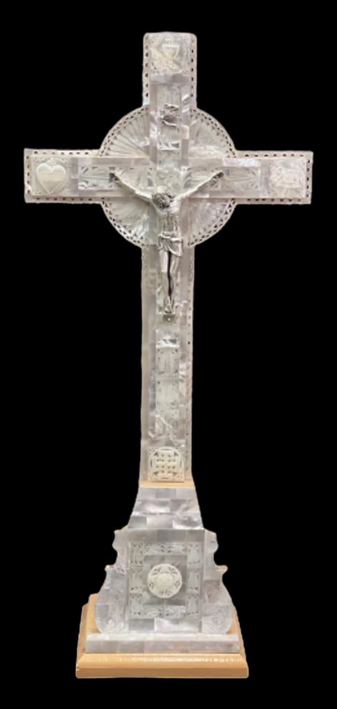Mother of pearl crucifix standing on a stepped pedestal base